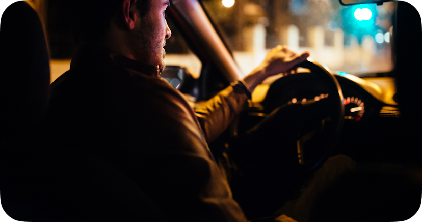 A man driving at night