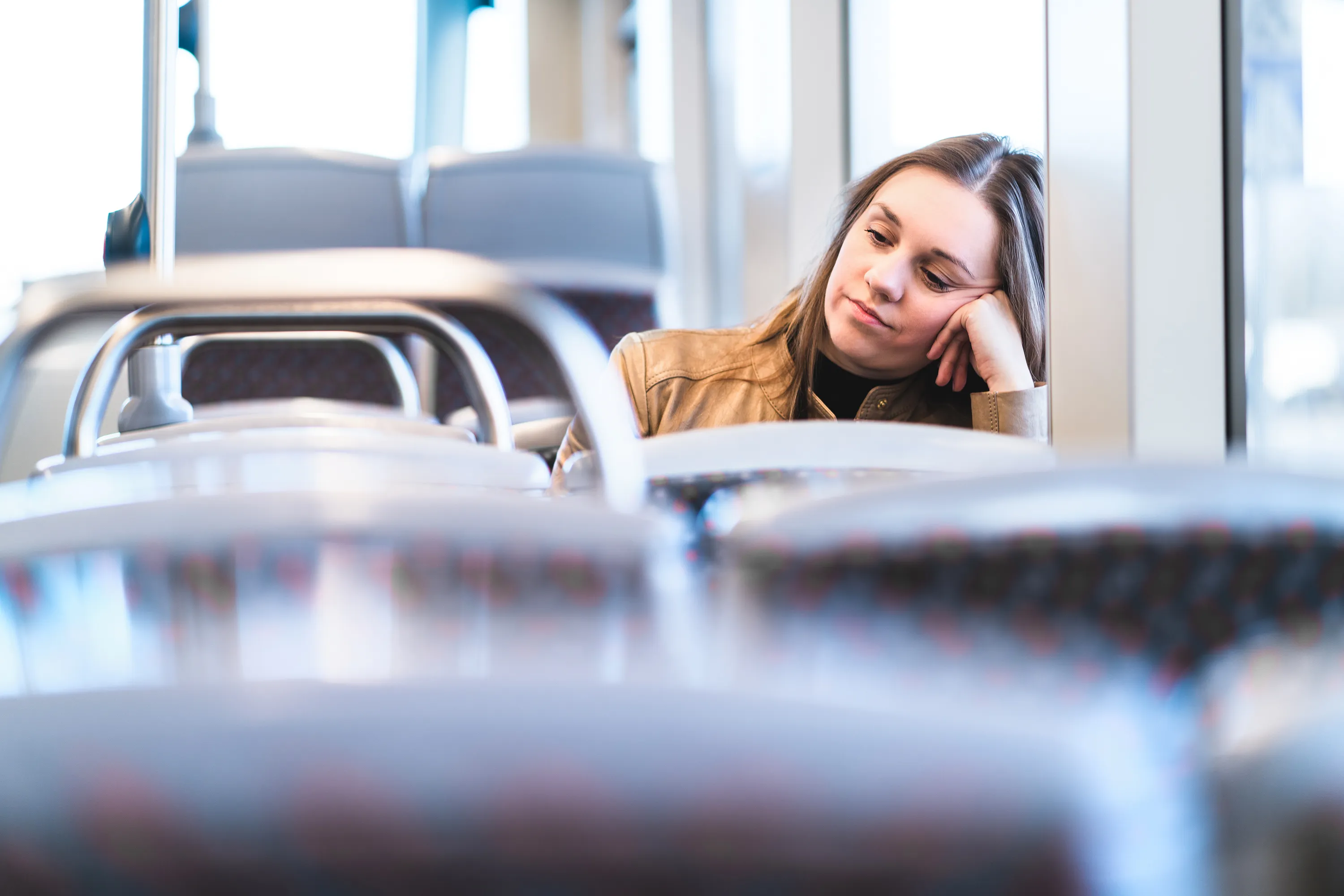 A woman riding a bus