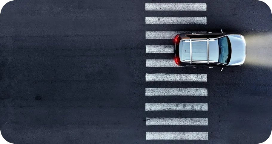 A car driving through a crosswalk